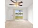 Bright bedroom features neutral carpet, view of the water and sliding glass door to patio at 116 Sheridan Ave, Longwood, FL 32750