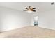 Carpeted bedroom featuring a ceiling fan and ensuite bathroom at 116 Sheridan Ave, Longwood, FL 32750