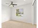 Well-lit bedroom featuring a ceiling fan and lake view at 116 Sheridan Ave, Longwood, FL 32750