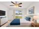 Comfortable bedroom featuring lake views, with soft blue and white color scheme at 116 Sheridan Ave, Longwood, FL 32750