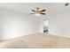 Spacious bedroom with plush carpeting and ceiling fan at 116 Sheridan Ave, Longwood, FL 32750