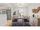 Dining room with a long table, blue rug, and decor at 116 Sheridan Ave, Longwood, FL 32750