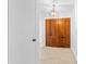 Foyer with solid wood doors, decorative light fixture and tile floors at 116 Sheridan Ave, Longwood, FL 32750