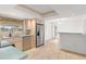 Kitchen featuring stainless steel appliances, light wood cabinets and light blue countertops at 116 Sheridan Ave, Longwood, FL 32750