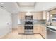 Kitchen featuring stainless steel appliances, light wood cabinets and backsplash window at 116 Sheridan Ave, Longwood, FL 32750