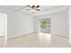 Bright living room featuring tile floors, ceiling beams, and sliding doors to patio at 116 Sheridan Ave, Longwood, FL 32750