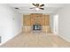 Living room featuring a brick fireplace and built-in shelving at 116 Sheridan Ave, Longwood, FL 32750