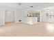 Spacious living area offering a seamless flow into the kitchen and dining spaces at 116 Sheridan Ave, Longwood, FL 32750