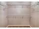 Spacious walk-in closet with wire shelving and hanging rods at 12557 Langstaff Dr, Windermere, FL 34786