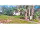 One-story house with palm trees in front at 1303 Stowe Ave, Mount Dora, FL 32757