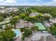 Community pool, tennis court, and surrounding buildings at 13103 Mulberry Park Dr # 811, Orlando, FL 32821