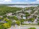 Aerial view of community with pool, tennis court, and lake at 13103 Mulberry Park Dr # 811, Orlando, FL 32821