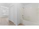 Bathroom with a bathtub and tiled walls at 13103 Mulberry Park Dr # 811, Orlando, FL 32821