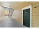 Condo entryway with green door and stairs at 13103 Mulberry Park Dr # 811, Orlando, FL 32821