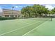 Outdoor tennis court with green surface at 13103 Mulberry Park Dr # 811, Orlando, FL 32821