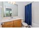 Bathroom with shower/tub combo and blue curtain at 1440 Waterview Ridge Cir, Apopka, FL 32703