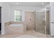 Spa-like bathroom with soaking tub and walk-in shower at 1440 Waterview Ridge Cir, Apopka, FL 32703