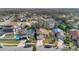 Aerial view of house and neighborhood, showcasing surrounding homes and landscape at 1448 Brook Hollow Dr, Orlando, FL 32824