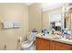 Small bathroom with toilet, sink, and vanity at 1448 Brook Hollow Dr, Orlando, FL 32824