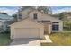 Two-story house with attached garage at 1448 Brook Hollow Dr, Orlando, FL 32824