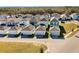 Aerial view of houses with garages and landscaping at 15450 Lebeau Loop, Winter Garden, FL 34787