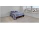 Bright bedroom with a double bed and ample natural light at 15450 Lebeau Loop, Winter Garden, FL 34787