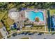 Aerial view of community pool and surrounding area at 15450 Lebeau Loop, Winter Garden, FL 34787