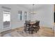 Bright dining room featuring a table with four chairs and access to a backyard at 15450 Lebeau Loop, Winter Garden, FL 34787