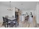 Dining area with a dark wood table and six chairs at 15450 Lebeau Loop, Winter Garden, FL 34787