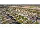 Aerial view of neighborhood with focus on a house and backyard at 165 Williamson Dr, Davenport, FL 33897