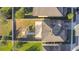 Aerial view of house, backyard patio, and surrounding neighborhood at 165 Williamson Dr, Davenport, FL 33897