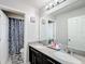 Bathroom with double vanity and shower/tub combo at 165 Williamson Dr, Davenport, FL 33897