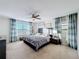 Main bedroom with a king-size bed and a dresser with a modern design at 165 Williamson Dr, Davenport, FL 33897