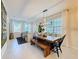 Bright dining area with a farmhouse table and bench seating at 165 Williamson Dr, Davenport, FL 33897