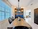 Farmhouse dining room with a wooden table and black chairs at 165 Williamson Dr, Davenport, FL 33897