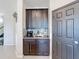 Kitchen nook with dark wood cabinets and granite countertops at 165 Williamson Dr, Davenport, FL 33897