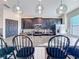 Modern kitchen island with seating for four at 165 Williamson Dr, Davenport, FL 33897