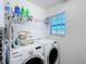 Laundry room with washer, dryer, and shelving at 165 Williamson Dr, Davenport, FL 33897