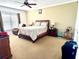 Comfortable bedroom with carpeted floors and ample natural light at 1708 Clubhouse Cv, Haines City, FL 33844