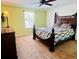 Spacious bedroom with king-size bed and ceiling fan at 1708 Clubhouse Cv, Haines City, FL 33844