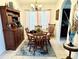 Formal dining room with wooden table and hutch at 1708 Clubhouse Cv, Haines City, FL 33844