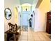 Bright and spacious entryway with tile flooring and a decorative console table at 1708 Clubhouse Cv, Haines City, FL 33844