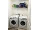 Laundry room with washer and dryer, and shelving at 1708 Clubhouse Cv, Haines City, FL 33844