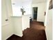 Upstairs hallway with carpet and views to other rooms at 1708 Clubhouse Cv, Haines City, FL 33844