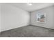 Bright bedroom with window and grey carpet at 1713 Fullers Oak Loop, Winter Garden, FL 34787