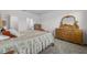 Spacious bedroom with a dresser and plenty of closet space at 1713 Fullers Oak Loop, Winter Garden, FL 34787