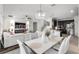 Bright dining room with white table and chairs, adjacent to the kitchen at 1713 Fullers Oak Loop, Winter Garden, FL 34787