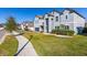 Two-story house with gray exterior, landscaping, and a two-car garage at 1713 Fullers Oak Loop, Winter Garden, FL 34787