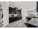 Spacious kitchen with dark wood cabinets, granite countertops and stainless steel appliances at 1713 Fullers Oak Loop, Winter Garden, FL 34787