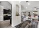 Kitchen with dark wood cabinets, granite countertops, and stainless steel appliances at 1713 Fullers Oak Loop, Winter Garden, FL 34787